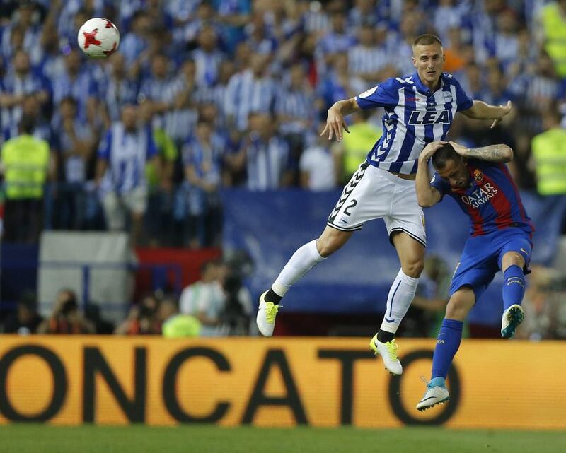 Barcelona’s Paco Alcacer, right, fights for the ball with Alaves’ Rodrigo Ely during the Copa del Rey final at the Vicente Calderon stadium in Madrid, Spain, Saturday May 27, 2017. Daniel Ochoa de Olza / AP Photo