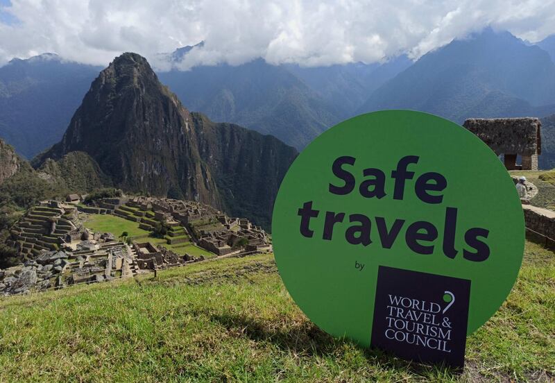 epa08742279 A handout photo made available by the Ministry of Foreign Trade and Tourism of Peru that shows the 'Safe travels' seal in Machu Picchu, Cuzco, Peru, 13 October 2020. Peru received from the World Travel and Tourism Council (WTTC) the Seal 'Safe travels', the first seal of biosecurity and hygiene in the world for tourism in times of COVID-19. Machu Picchu will be part of a second phase of reopening to tourism of archaeological sites that will begin 15 October.  EPA/Ministry of Foreign Trade and Tourism HANDOUT  HANDOUT EDITORIAL USE ONLY/NO SALES