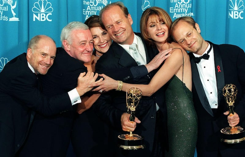 (FILES) In this file photo taken on September 13, 1998 the cast of the television situation comedy "Frasier" pose with their Emmy for Outstanding Comedy Series at the 50th Annual Primetime Emmy Awards in Los Angeles (From L-R:) Dan Butler, John Mahoney, Peri Gilpin, Kelsey Grammer, Jane Leeves and David Hyde Pierce. 
Actor John Mahoney, who portrayed the no-nonsense father in the TV sitcom "Frasier," has died in Chicago at the age of 77, his longtime theater company said on February 5, 2018. / AFP PHOTO / KIM KULISH