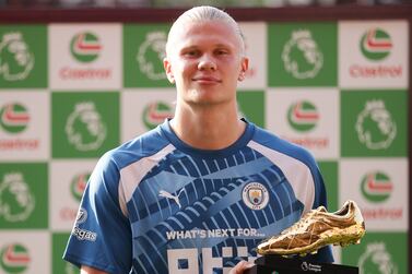 BRENTFORD, ENGLAND - MAY 28: Erling Haaland of Manchester City poses for a photo after being awarded the Premier League Castrol Golden Boot 2022/23 Award during the Premier League match between Brentford FC and Manchester City at Gtech Community Stadium on May 28, 2023 in Brentford, England. (Photo by Alex Pantling / Getty Images)