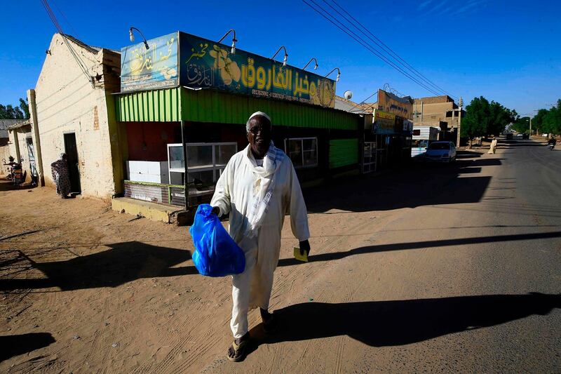 Sudanese people buy bread at a bakery in the town of Atbara, an industrial town 350 kilometres northeast of Sudan's capital Khartoum. AFP