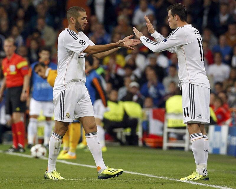 Carlo Ancelotti defended the performances of Karim Benzema, left, and Gareth Bale, right on Wednesday. Paul Hanna / Reuters
