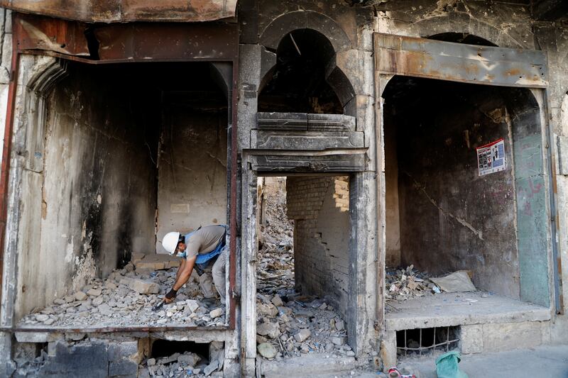 A member of a demining squad takes part in an operation to clear mines in the Old City of Mosul.