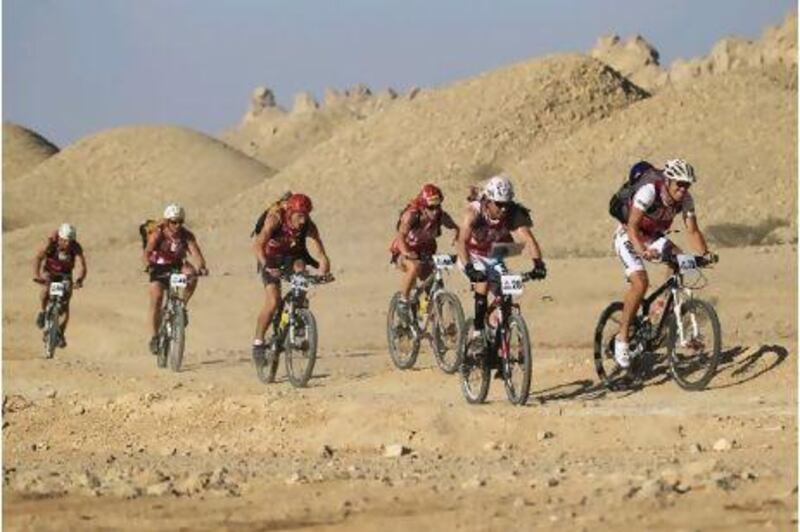 Cyclists negotiate Jebel Hafeet's rocky terrain on the second day of the Abu Dhabi Adventure Challenge yesterday.