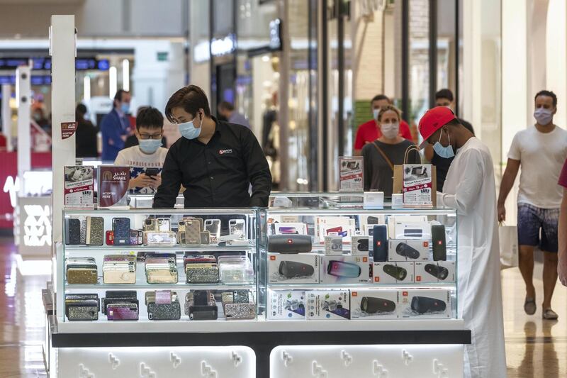 DUBAI, UNITED ARAB EMIRATES. 24 MAY 2020. The first day of the Eid holidays saw shoppers head to Mall of the Emirates to shop for both food and luxury items. Mall staff have put in place thermal scanning at entry ways and shops are supplying hand santizer and in some cases glothes when shoppers enter the stores. Social distancing is also being observed for the most part as restrictions are in place by Dubai Government. (Photo: Antonie Robertson/The National) Journalist: Kelly Clarke. Section: National.