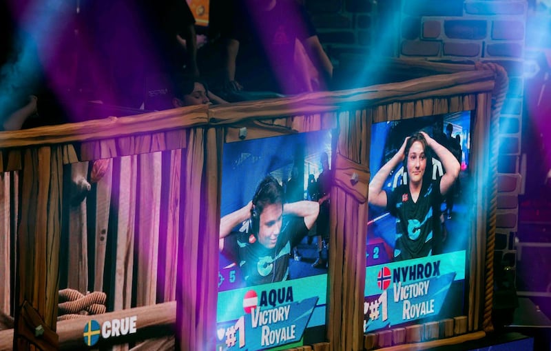 Emil "Nyhrox" Bergquist Pedersen (R) and Thomas "Aqua" Arnould react as they win a match during the Duos competition at the 2019 Fortnite World Cup July 27, 2019 inside of Arthur Ashe Stadium, in New York City. / AFP / Johannes EISELE
