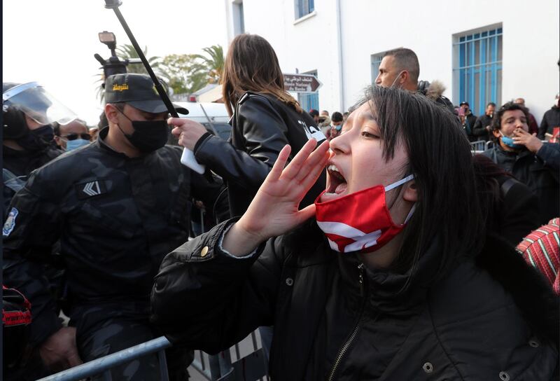 Protesters shout slogans during a demonstration next to the Tunisian parliament in Tunis, Tunisia. EPA