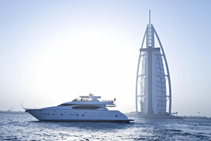 A yacht sails around the Burj Al Arab. Courtesy Xclusive Yachts