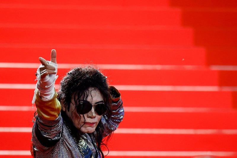 A person dressed as Michael Jackson poses on the red carpet before the screening of the film 'All We Imagine as Light' at the 77th Cannes Film Festival. Reuters
