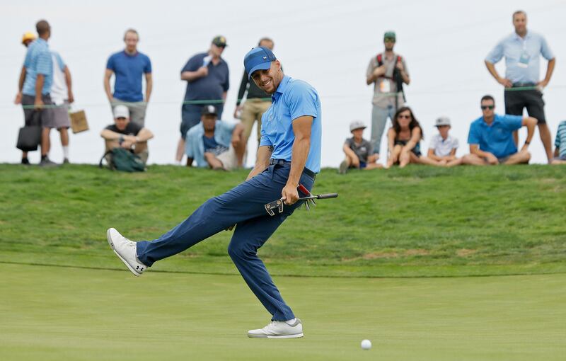 Golden State Warriors NBA basketball player Stephen Curry reacts after missing a birdie putt on the eighth green during the Web.com Tour's Ellie Mae Classic golf tournament Thursday, Aug. 3, 2017, in Hayward, Calif. Curry shot a 4-over-par 74. (AP Photo/Eric Risberg)