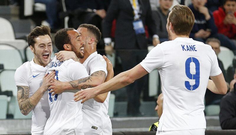 England's Andros Townsend, second from left, celebrates with team mates after scoring the first goal for England. They played to a 1-1 draw with Italy on Tuesday. Reuters / Carl Recine