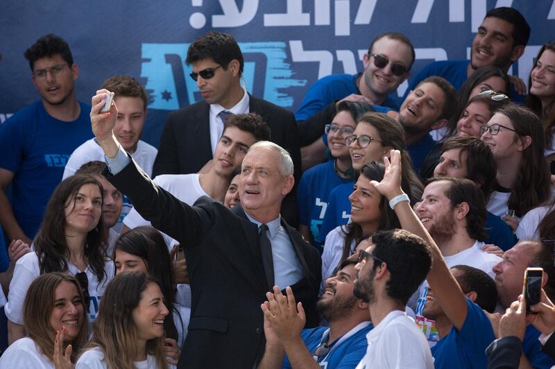 Blue and White party leader Benny Gantz takes a picture with his supporters during an election campaign rally in Tel Aviv. AP Photo