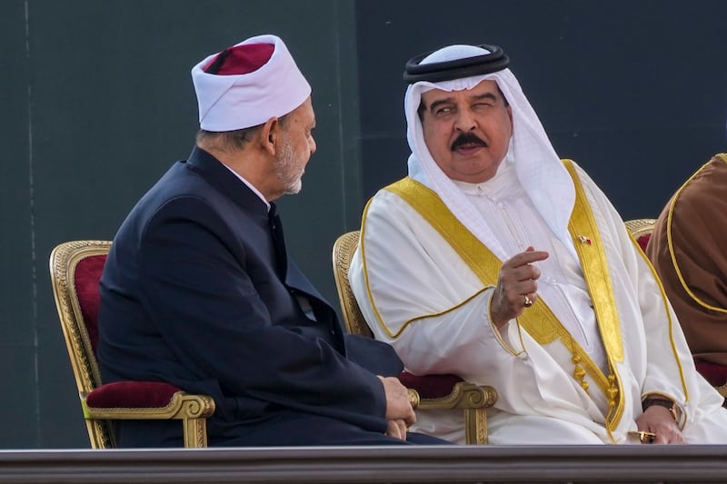 Bahrain's King Hamad, right, and Dr Ahmed El Tayeb, the Grand Imam of Al Azhar, talk as they wait for the arrival of the Pope at the closing session of the forum. AP