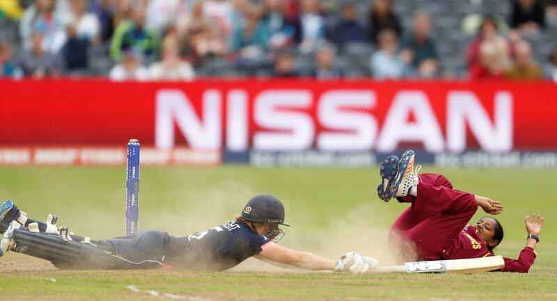 West Indies' Anisa Mohammed attempts to run out England’s Heather Knight during the Women's Cricket World Cup. John Sibley.