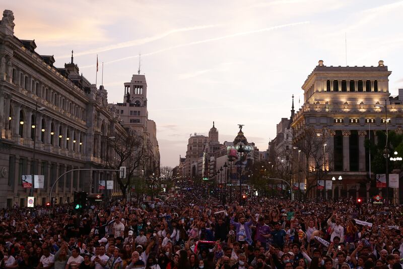 Fans of Real Madrid celebrate at Plaza de Cibeles following the the club's La Liga title. Getty