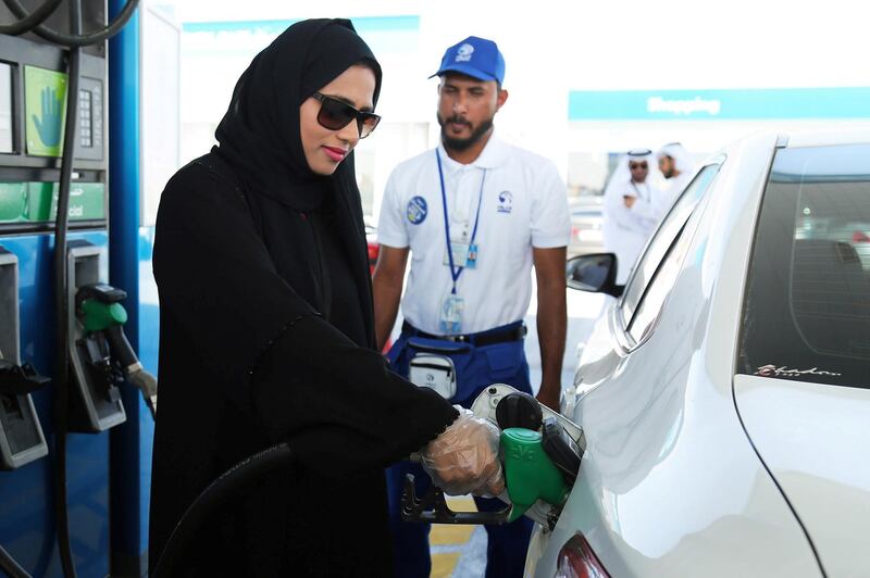 Emirati woman chooses Self Service option at ADNOC service stations. Courtesy Adnoc Distribution