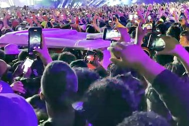 Ambulance is seen in the crowd during rap star Travis Scott's Astroworld festival in Houston, Texas, U. S. , in this still image from social media video November 5, 2021.    TWITTER @ONACASELLA/via REUTERS  ATTENTION EDITORS - THIS IMAGE HAS BEEN SUPPLIED BY A THIRD PARTY.  MANDATORY CREDIT