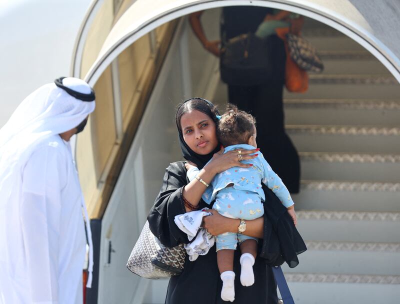 A woman and child evacuated from Sudan arrive in Abu Dhabi on April 29. Reuters