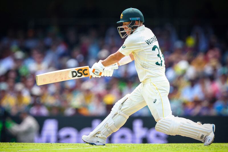 Australia's David Warner plays a reverse sweep. AFP