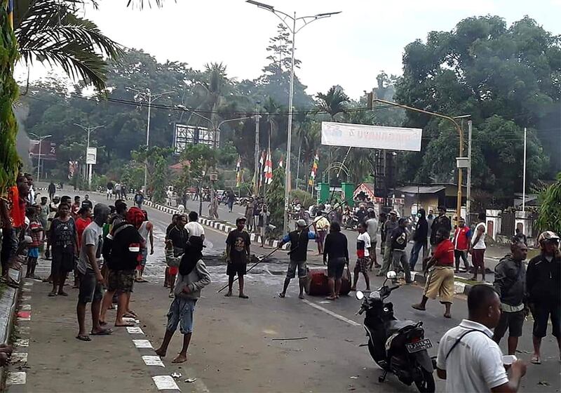 Protesters take to the street to face off with Indonesian police. AFP
