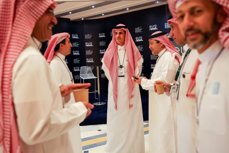 Tareq Al Sadhan, chief executive of Riyadh Bank, centre, at the FII conference. Rising energy prices are likely to linger for some time, posing one of the most serious challenges to the global economic recovery and raising the potential risk of social unrest, some of the world's top executives said on the first day of the investment forum. Bloomberg