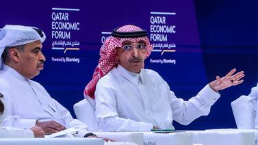 Qatar's Finance Minister Ali Al Kuwari, left, listens as his Saudi counterpart Mohammed Al Jadaan speaks at the Qatar Economic Forum in Doha. AFP