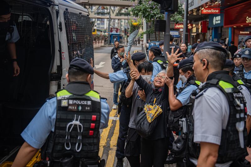 Activist Alexandra Wong is led to a police van after being detained at Causeway Bay near Victoria Park in Hong Kong, China. EPA 