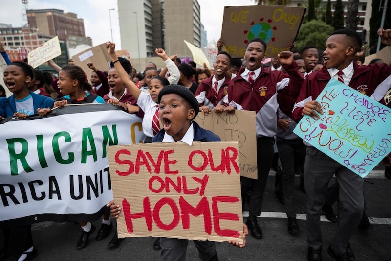 Protesters take part in the Global Climate Strike as they march to parliament in Cape Town, South Africa. EPA