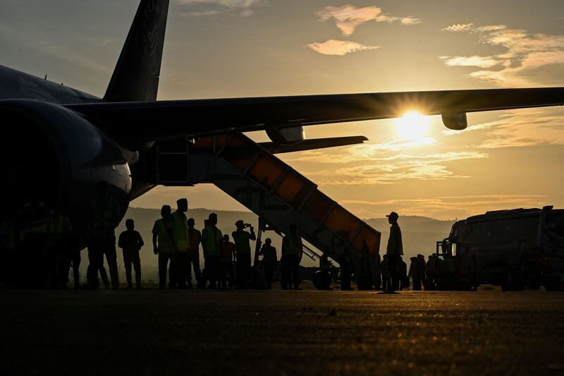 Pilgrims board a passenger plane heading to Mecca. AFP
