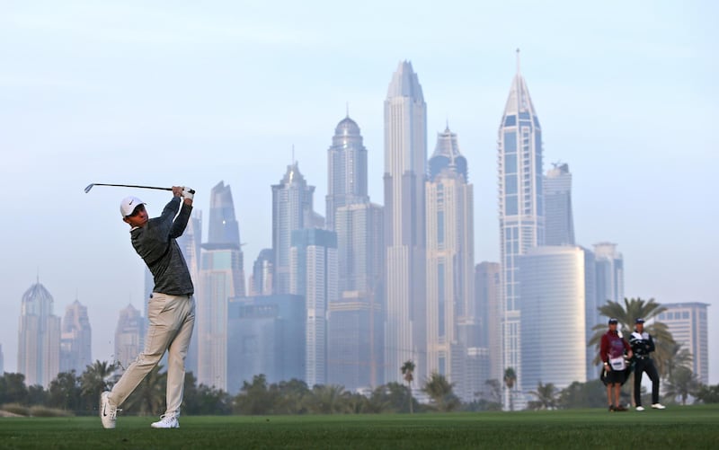 Northern Ireland's Rory McIlroy plays a shot on the 13th hole during the second round, which was delayed due to fog on Friday, of the Dubai Desert Classic golf tournament in Dubai, United Arab Emirates, Saturday, Jan. 27, 2018. (AP Photo/Kamran Jebreili)