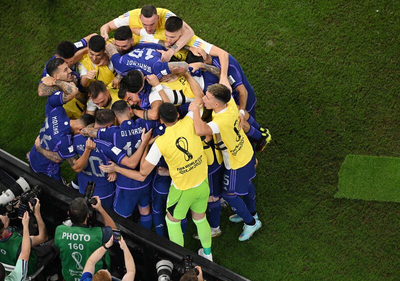 Argentina's Alexis Mac Allister celebrates with teammates after scoring. Getty