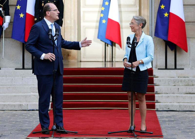 France's departing Prime Minister Jean Castex delivers a speech next to his successor, former labour minister Elisabeth Borne, during a handover ceremony in the courtyard of the Hotel Matignon, the French prime minister's official residence, in Paris. AFP