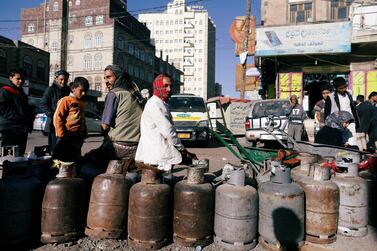 People wait to fill their cooking gas cylinders outside a gas filling station amid a scarcity in cooking gas supplies in Sanaa, Yemen March 4, 2018. Reuters