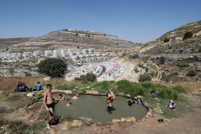 Israelis swim near the Jewish settlement of Givat Ze'ev in the West Bank, north of Jerusalem. EPA
