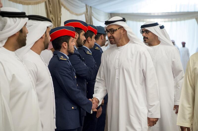 Sheikh Mohammed bin Zayed, Crown Prince of Abu Dhabi and Deputy Supreme Commander of the Armed Forces, offers condolences to the family of martyr Zayed Al Kaabi who died while serving with the Armed Forces in ‘Operation Restoring Hope’. He is seen with Major General Sheikh Khaled bin Mohammed bin Zayed, Chairman of the State Security Department, back left. Rashed Al Mansoori / Crown Prince Court - Abu Dhabi