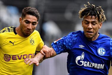 Soccer Football - Bundesliga - Borussia Dortmund v Schalke 04 - Signal Iduna Park, Dortmund, Germany - May 16, 2020 Dortmund's Achraf Hakimi in action with Schalke's Jean-Clair Todibo, as play resumes behind closed doors following the outbreak of the coronavirus disease (COVID-19) Martin Meissner/Pool via REUTERS DFL regulations prohibit any use of photographs as image sequences and/or quasi-video