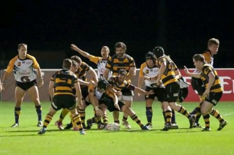 The Dubai Wasps, in yellow and black stripes, were defeated by the UAE Premiership defending champions.