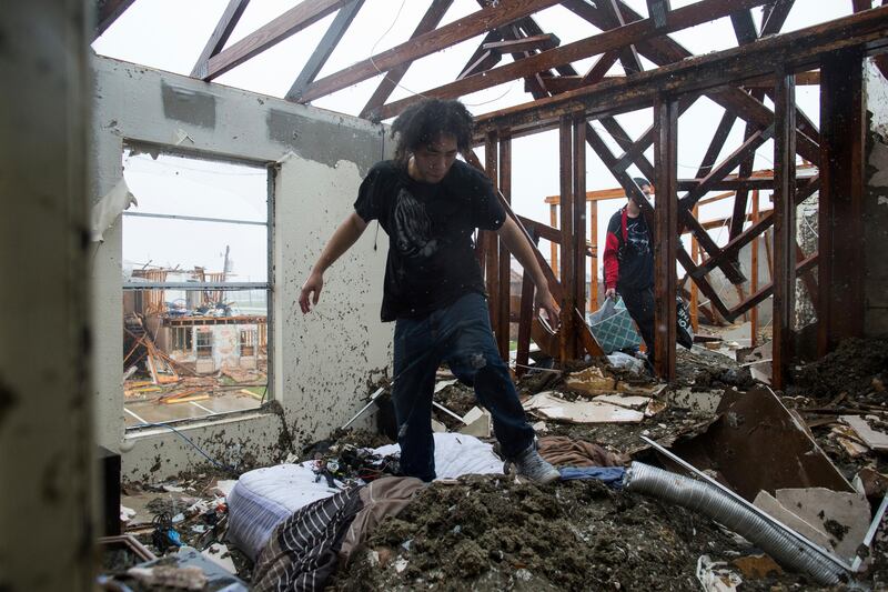 Michael Thomas and his brother Deeantre try to collect belongings in their Saltgrass Landing apartment complex, destroyed by Hurricane Harvey,  in Rockport, Texas. Courtney Sacco / Corpus Christi Caller-Times via AP