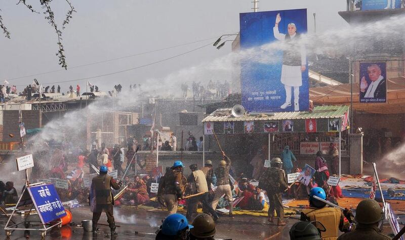 Police try to disperse supporters of Sant Rampal at Hisar in Haryana yesterday. Bansilal Basniwal / AP Photo