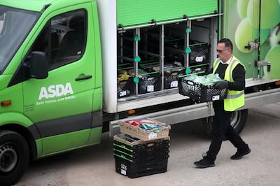 FILE PHOTO: An Asda employee makes a delivery in Keele, as the spread of the coronavirus disease (COVID-19) continues, Keele, Britain, April 1, 2020. REUTERS/Carl Recine/File Photo