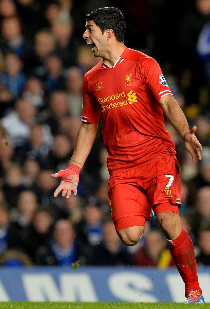 Liverpool's Uruguayan striker Luis Suarez reacts during the English Premier League football match between Chelsea and Liverpool at Stamford Bridge in London on December 29, 2013.  AFP PHOTO / BEN STANSALL

RESTRICTED TO EDITORIAL USE. No use with unauthorized audio, video, data, fixture lists, club/league logos or “live” services. Online in-match use limited to 45 images, no video emulation. No use in betting, games or single club/league/player publications. (Photo by BEN STANSALL / AFP)