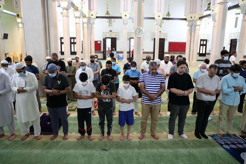 Worshippers gather for evening prayers at Jumeirah Mosque in Dubai. On Friday, the UAE learnt of the death of President Sheikh Khalifa. Pawan Singh / The National 