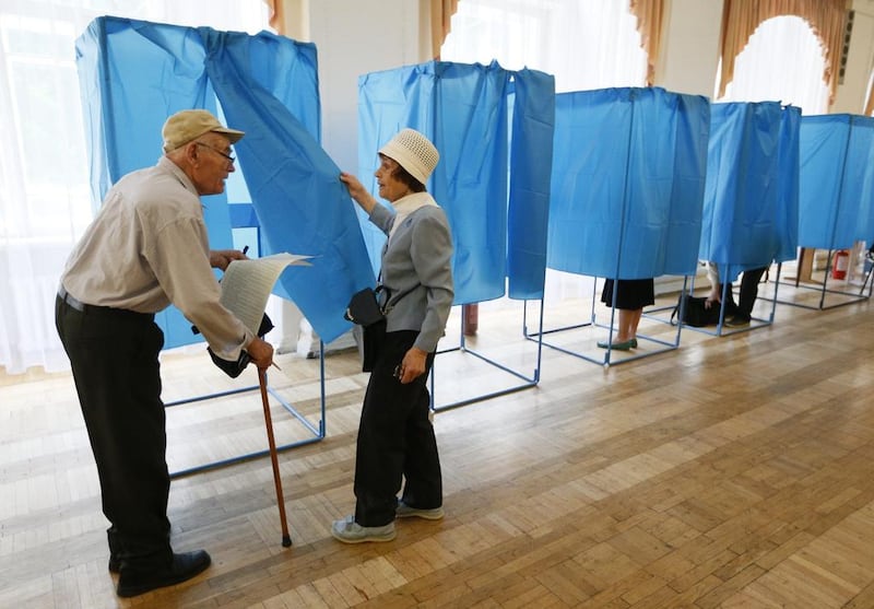 Voters entering a polling booth before casting their ballots in the presidential election. Gleb Garanich/Reuters