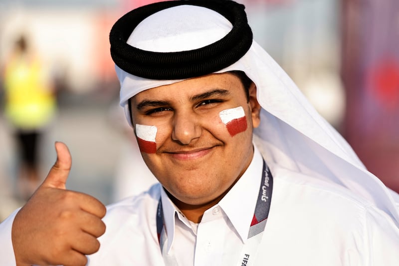 A Qatar fan wears his national colours outside the Al Bayt Stadium. Reuters