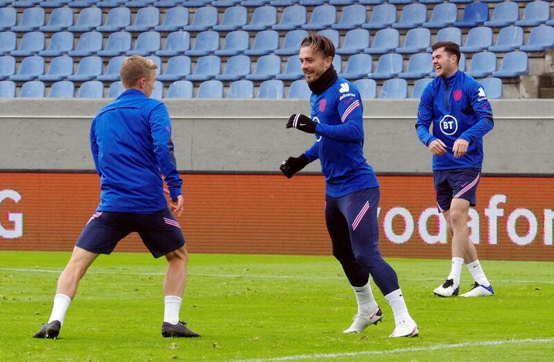 England's James Ward-Prowse, left, Jack Grealish and Michael Keane during training. Reuters