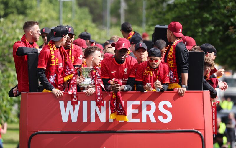 Liverpool's Diogo Jota with the FA Cup trophy during the parade. Reuters