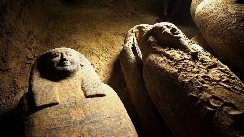 Some of the 2,500-year-old wooden coffins discovered in a burial shaft at the desert necropolis of Saqqara south of Cairo.  AFP
