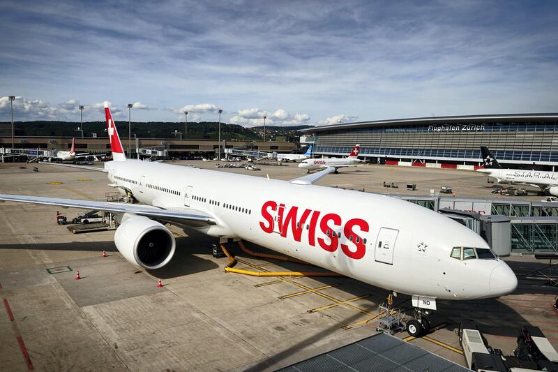 This picture taken on July 6, 2016, shows Swiss International Airlines' Boeing 777 parked on the tarmac at the Zurich Airport in Zurich. (Photo by MICHAEL BUHOLZER / AFP)