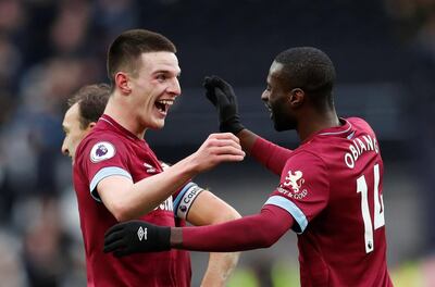 Soccer Football - Premier League - West Ham United v Arsenal - London Stadium, London, Britain - January 12, 2019  West Ham's Declan Rice celebrates after the match with Pedro Obiang                    REUTERS/David Klein  EDITORIAL USE ONLY. No use with unauthorized audio, video, data, fixture lists, club/league logos or "live" services. Online in-match use limited to 75 images, no video emulation. No use in betting, games or single club/league/player publications.  Please contact your account representative for further details.