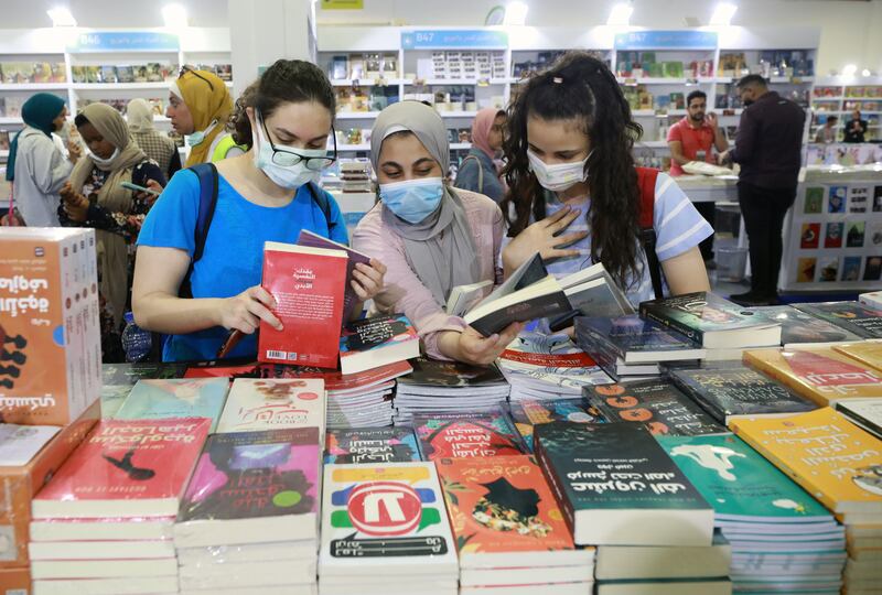 Visitors attend Cairo International Book Fair. EPA